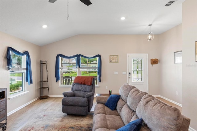 65 Lob Wedge Ln, Bunnell, FL 32110 - living room with light wood-type flooring, lofted ceiling, baseboards, recessed lighting, and ceiling fan