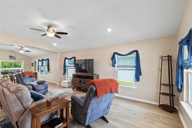 65 Lob Wedge Ln, Bunnell, FL 32110 - living area with lofted ceiling, light wood-style floors, ceiling fan, baseboards, and recessed lighting