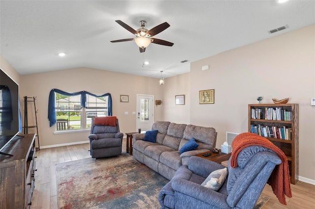 65 Lob Wedge Ln, Bunnell, FL 32110 - living room with wood finished floors, a ceiling fan, recessed lighting, vaulted ceiling, and baseboards