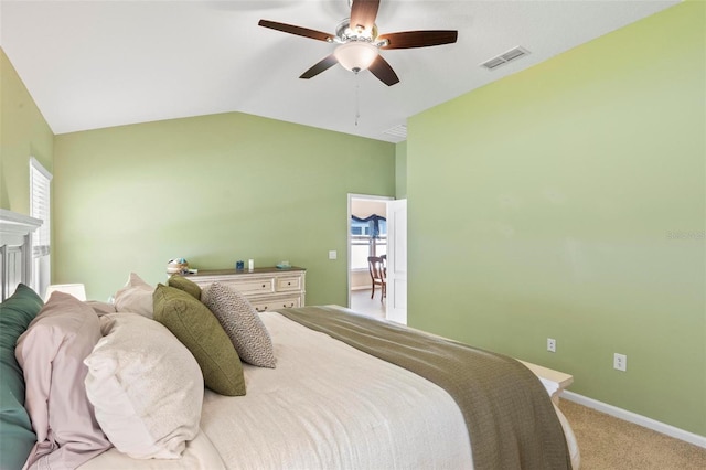 65 Lob Wedge Ln, Bunnell, FL 32110 - bedroom with light colored carpet, vaulted ceiling, baseboards, and a ceiling fan