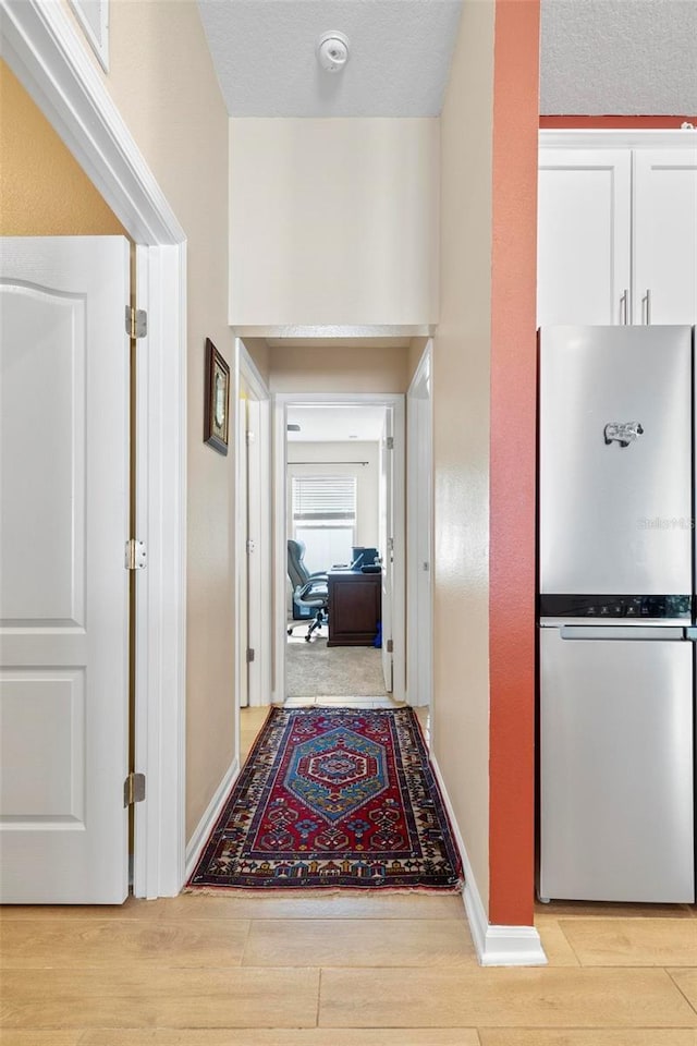 65 Lob Wedge Ln, Bunnell, FL 32110 - hall featuring light wood-style flooring