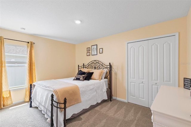 65 Lob Wedge Ln, Bunnell, FL 32110 - bedroom with carpet floors, a closet, and baseboards