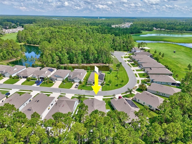 65 Lob Wedge Ln, Bunnell, FL 32110 - aerial view of property's location featuring a nearby body of water, nearby suburban area, a golf course, and a heavily wooded area