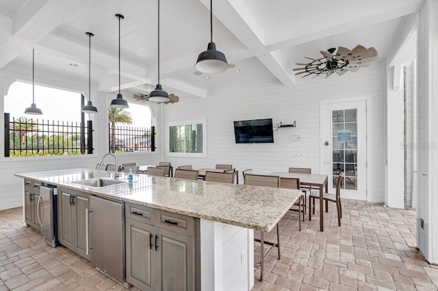 65 Lob Wedge Ln, Bunnell, FL 32110 - kitchen with a sink, coffered ceiling, open floor plan, a center island with sink, and hanging light fixtures