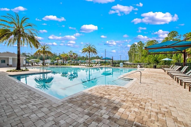 65 Lob Wedge Ln, Bunnell, FL 32110 - community pool with a patio