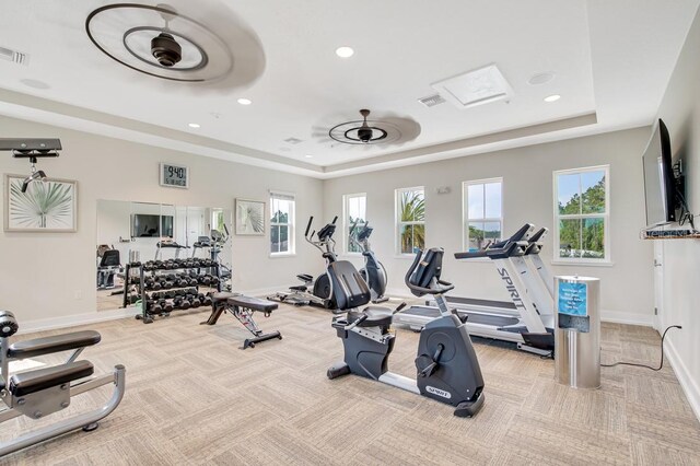 65 Lob Wedge Ln, Bunnell, FL 32110 - gym with a tray ceiling, carpet, baseboards, and recessed lighting
