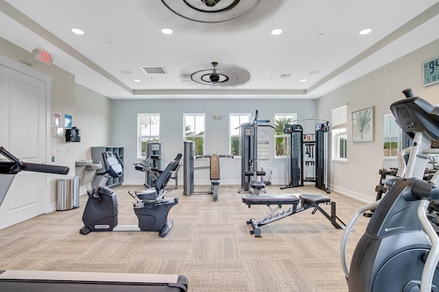 65 Lob Wedge Ln, Bunnell, FL 32110 - gym with a raised ceiling, light carpet, recessed lighting, baseboards, and healthy amount of natural light