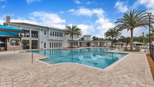 818 Grand Reserve Dr, Bunnell, FL 32110 - community pool featuring a patio
