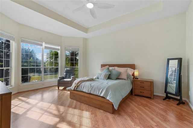 775 Blackmoor Gate Ln, Saint Augustine, FL 32084 - bedroom with wood finished floors, a tray ceiling, baseboards, and a ceiling fan