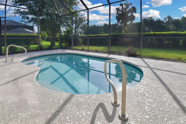 775 Blackmoor Gate Ln, Saint Augustine, FL 32084 - outdoor pool featuring glass enclosure and a patio area