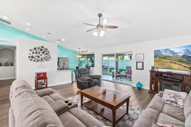 8 Buttermill Dr, Palm Coast, FL 32137 - living room with vaulted ceiling, a ceiling fan, wood finished floors, recessed lighting, and baseboards