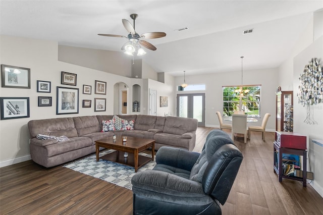 8 Buttermill Dr, Palm Coast, FL 32137 - living area featuring lofted ceiling, dark wood finished floors, baseboards, ceiling fan, and a chandelier