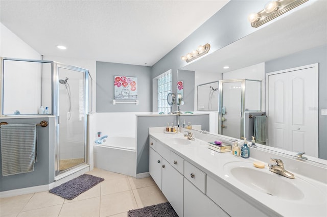8 Buttermill Dr, Palm Coast, FL 32137 - bathroom with a shower stall, a bath, double vanity, and tile patterned floors