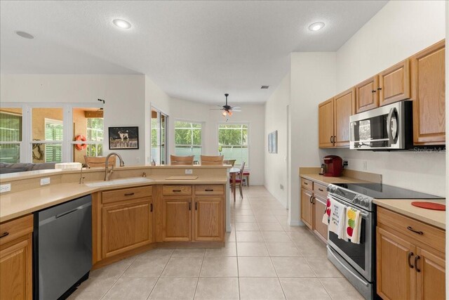 58 Slocum Path, Palm Coast, FL 32164 - kitchen featuring stainless steel appliances, a sink, light countertops, ceiling fan, and recessed lighting