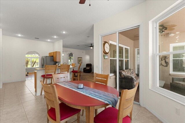 58 Slocum Path, Palm Coast, FL 32164 - dining room with ceiling fan, arched walkways, light tile patterned floors, recessed lighting, and baseboards