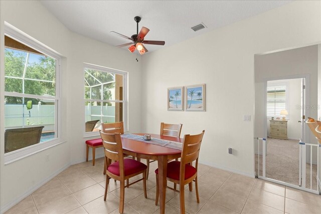 58 Slocum Path, Palm Coast, FL 32164 - dining space featuring a ceiling fan, light tile patterned floors, and baseboards