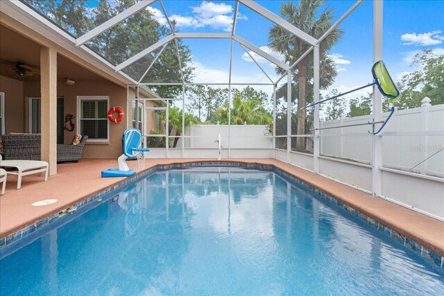 58 Slocum Path, Palm Coast, FL 32164 - view of pool featuring a patio, glass enclosure, and ceiling fan