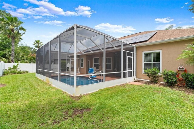 58 Slocum Path, Palm Coast, FL 32164 - rear view of house with a patio, a shingled roof, stucco siding, and glass enclosure