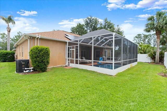 58 Slocum Path, Palm Coast, FL 32164 - back of property with stucco siding and a lanai