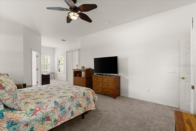 58 Slocum Path, Palm Coast, FL 32164 - bedroom with light carpet, a ceiling fan, and baseboards