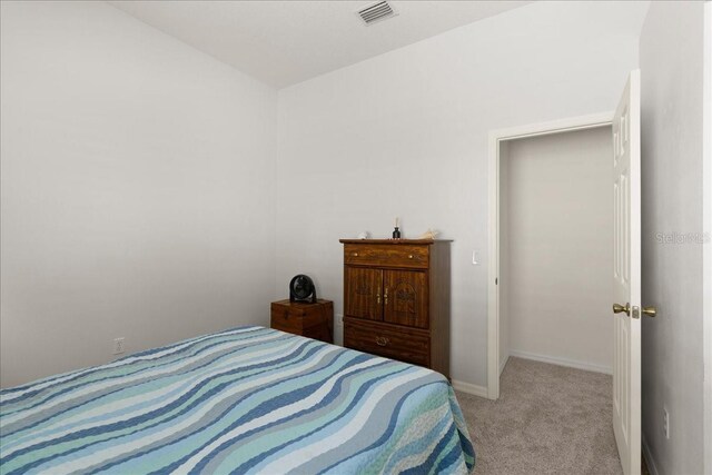 58 Slocum Path, Palm Coast, FL 32164 - bedroom with light colored carpet and baseboards