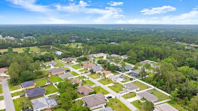 58 Slocum Path, Palm Coast, FL 32164 - aerial view of property and surrounding area featuring a forest and nearby suburban area