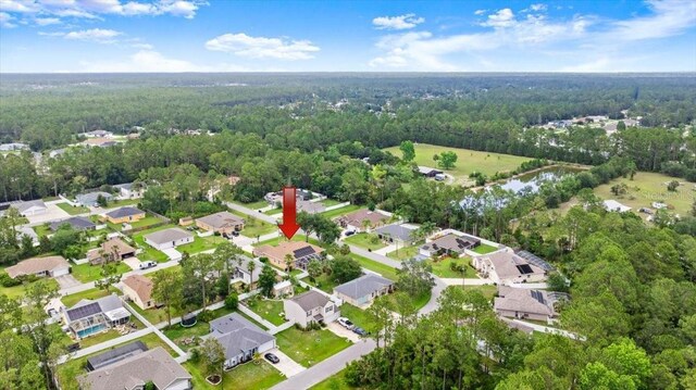 58 Slocum Path, Palm Coast, FL 32164 - aerial overview of property's location with a forest and nearby suburban area
