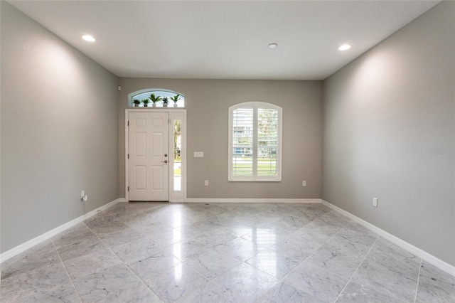 45 Atlantic Dr, Palm Coast, FL 32137 - entryway featuring baseboards, recessed lighting, and light marble finish flooring