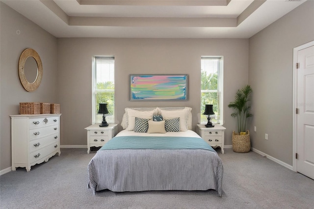 45 Atlantic Dr, Palm Coast, FL 32137 - bedroom with light carpet, baseboards, and a tray ceiling