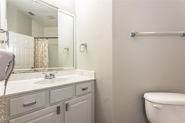 45 Atlantic Dr, Palm Coast, FL 32137 - bathroom featuring vanity, toilet, and a shower with curtain
