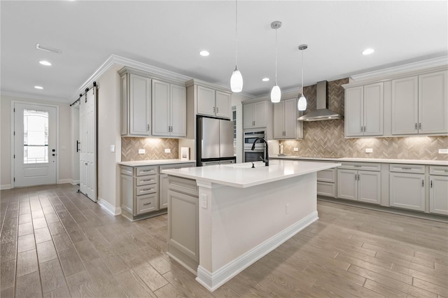 13 Las Brisas Way, Palm Coast, FL 32137 - kitchen with wall chimney exhaust hood, stainless steel appliances, crown molding, light countertops, and decorative backsplash
