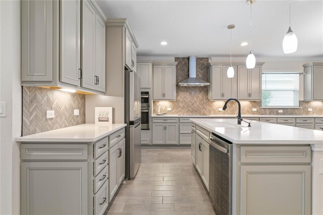 13 Las Brisas Way, Palm Coast, FL 32137 - kitchen with wall chimney exhaust hood, a sink, appliances with stainless steel finishes, tasteful backsplash, and recessed lighting