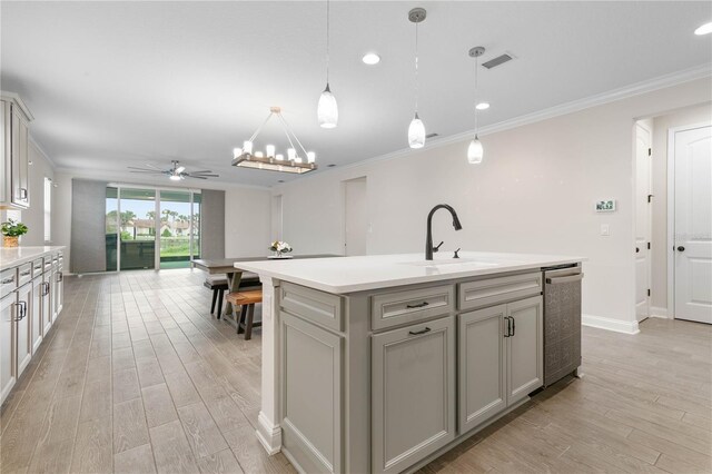 13 Las Brisas Way, Palm Coast, FL 32137 - kitchen featuring gray cabinetry, a sink, ceiling fan, light countertops, and light wood finished floors