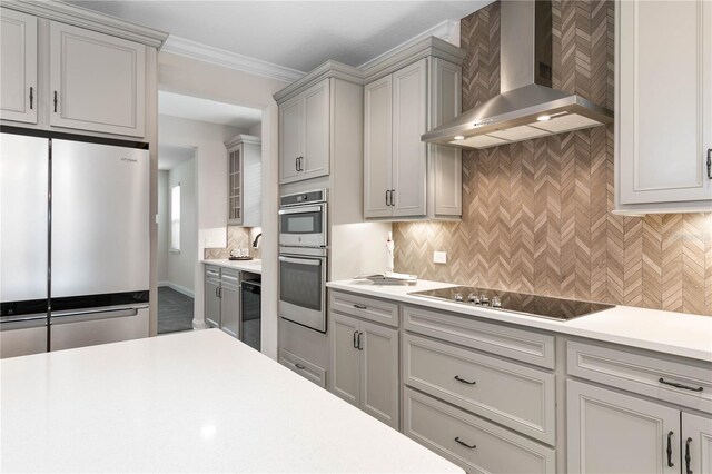 13 Las Brisas Way, Palm Coast, FL 32137 - kitchen with appliances with stainless steel finishes, wall chimney exhaust hood, light countertops, gray cabinetry, and backsplash