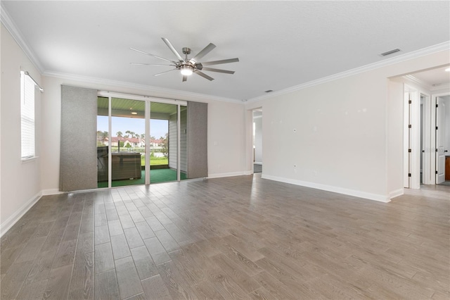 13 Las Brisas Way, Palm Coast, FL 32137 - spare room with a ceiling fan, wood finished floors, ornamental molding, and baseboards