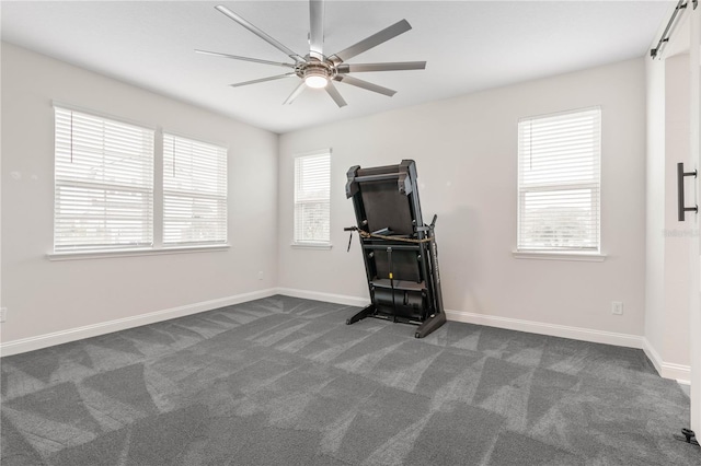13 Las Brisas Way, Palm Coast, FL 32137 - unfurnished bedroom with dark colored carpet, baseboards, and a ceiling fan