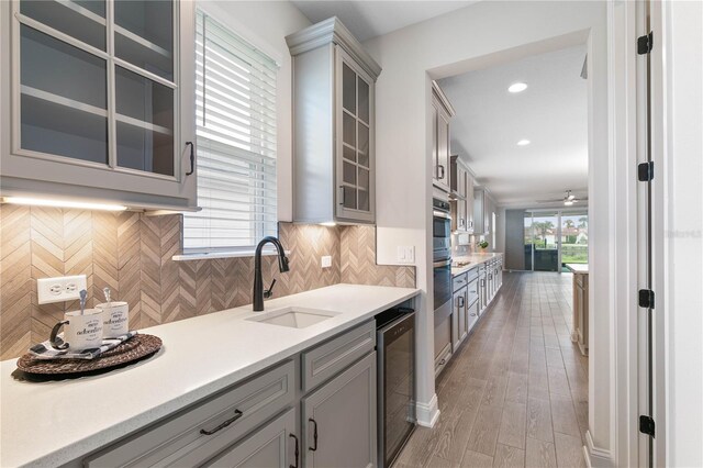 13 Las Brisas Way, Palm Coast, FL 32137 - kitchen featuring a sink, gray cabinetry, light countertops, and recessed lighting