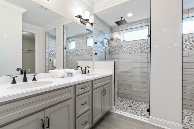 13 Las Brisas Way, Palm Coast, FL 32137 - full bathroom featuring a tile shower, ornamental molding, double vanity, and baseboards