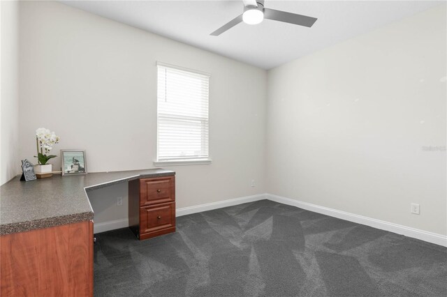 13 Las Brisas Way, Palm Coast, FL 32137 - unfurnished office featuring a ceiling fan, dark colored carpet, and baseboards