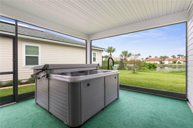 13 Las Brisas Way, Palm Coast, FL 32137 - sunroom / solarium with a hot tub, a water view, and healthy amount of natural light