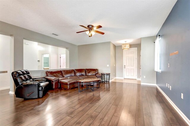 1 Rockwell Ln W, Palm Coast, FL 32164 - living area with wood finished floors, a ceiling fan, and baseboards
