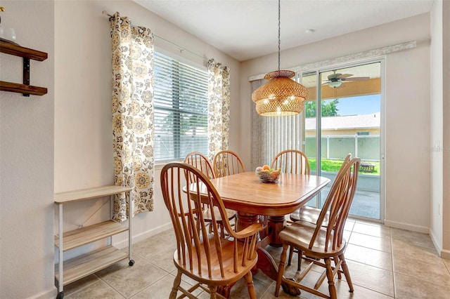 1 Rockwell Ln W, Palm Coast, FL 32164 - dining area featuring light tile patterned flooring, baseboards, and ceiling fan