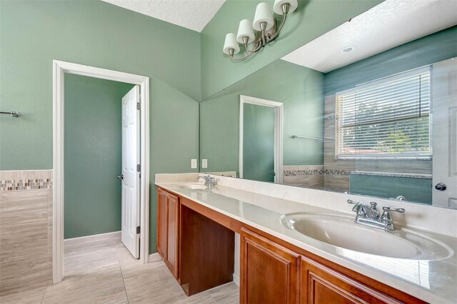 1 Rockwell Ln W, Palm Coast, FL 32164 - bathroom with double vanity and tile patterned flooring