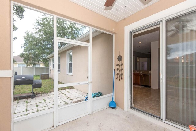 1 Rockwell Ln W, Palm Coast, FL 32164 - unfurnished sunroom featuring a ceiling fan