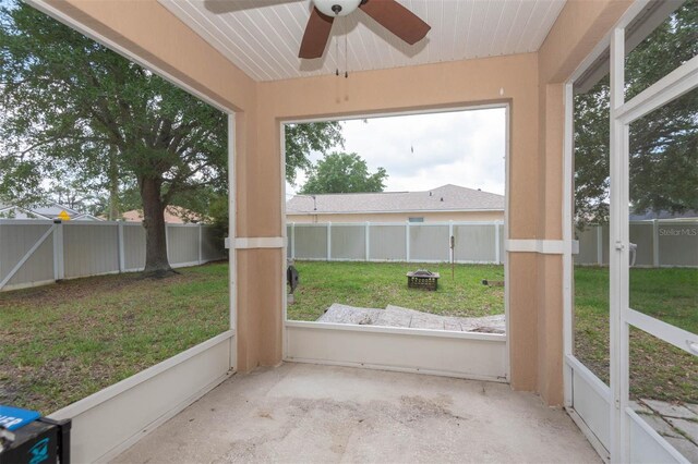1 Rockwell Ln W, Palm Coast, FL 32164 - unfurnished sunroom featuring a ceiling fan and a fire pit