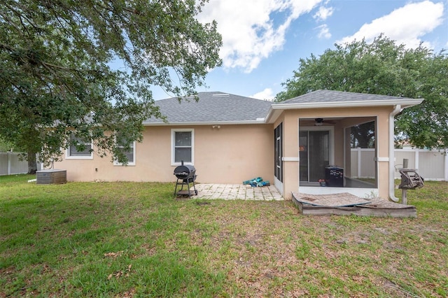 1 Rockwell Ln W, Palm Coast, FL 32164 - back of house featuring ceiling fan, stucco siding, a patio area, a sunroom, and central AC unit