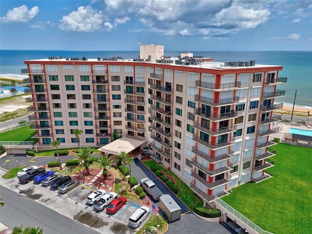 3600 S Ocean Shore Blvd Unit 222, Flagler Beach, FL 32136 - view of apartment building / complex with a water view and uncovered parking