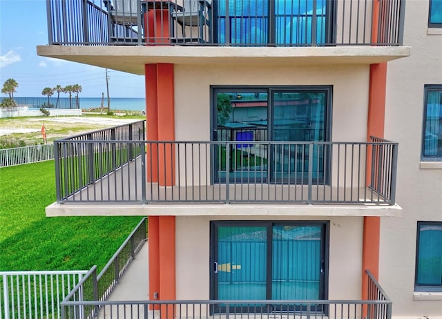 3600 S Ocean Shore Blvd Unit 222, Flagler Beach, FL 32136 - view of side of property with a balcony, stucco siding, and a water view