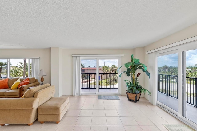 3600 S Ocean Shore Blvd Unit 222, Flagler Beach, FL 32136 - living area with plenty of natural light, a textured ceiling, and light tile patterned flooring