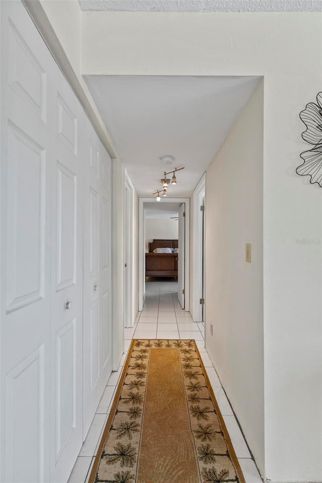 3600 S Ocean Shore Blvd Unit 222, Flagler Beach, FL 32136 - corridor featuring light tile patterned floors